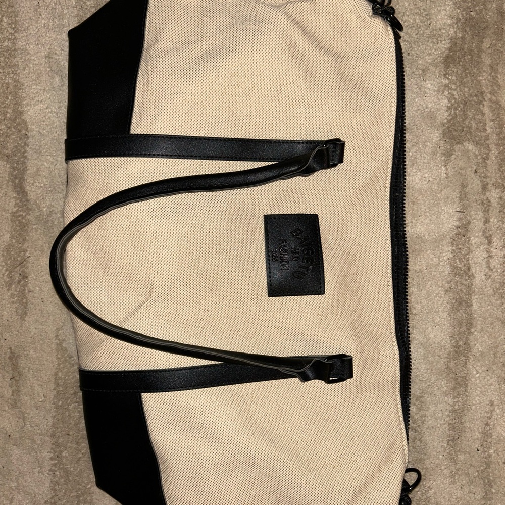 Stylish Black and Tan Duffel Bag